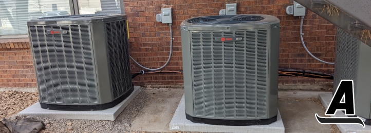 Air Conditioning units outside a brick building